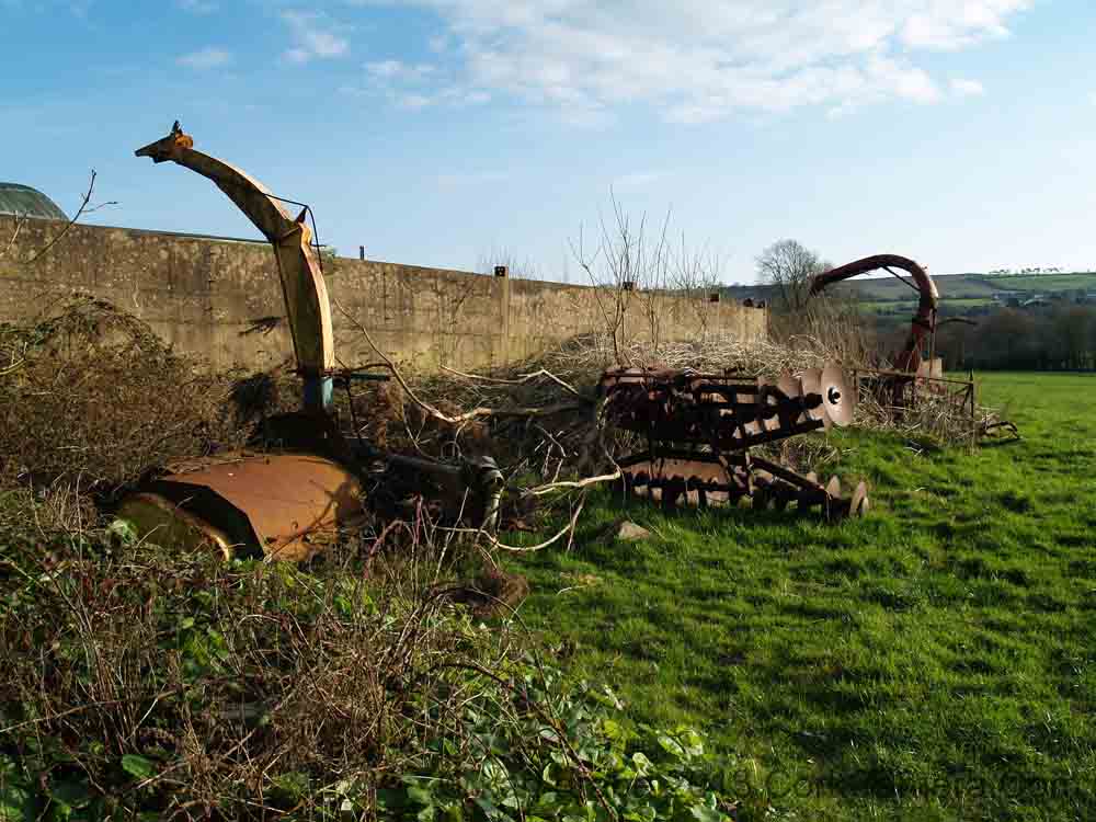 KG180143 farm machinery on way to tower village